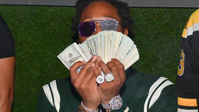 Man With Dollars In Hands